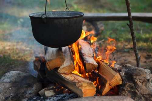 Preparing food on campfire