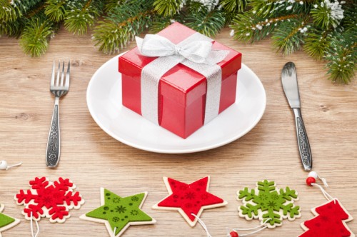 Gift box on plate and silverware