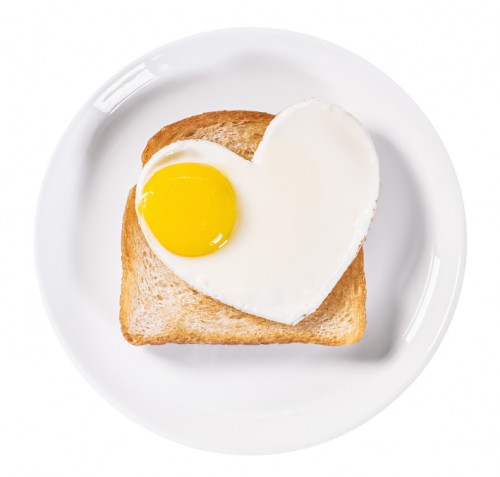 heart-shaped fried eggs and fried toast isolated