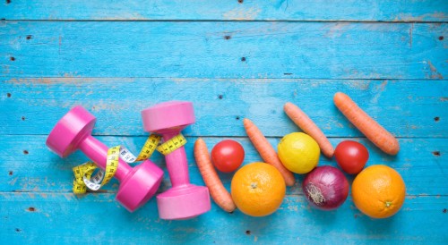 Dumbbells and healthy food, fitness and dieting, free copy space