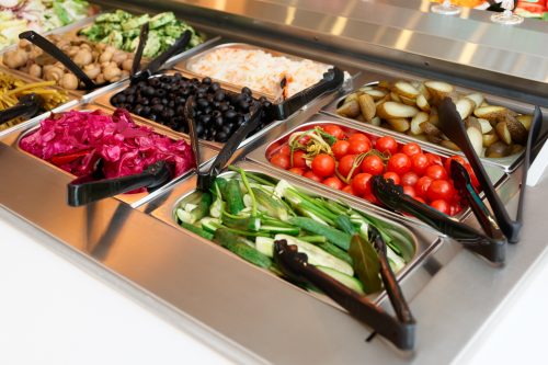 Pickled vegetables on self service restaurant counter