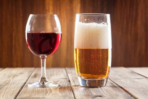 Red wine glass and glass of light beer